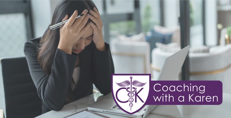 Coaching with a Karen blog graphic: a stressed professional at a desk holding her head in her hands beside a laptop