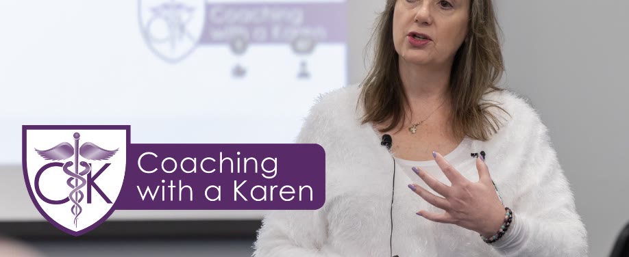 Karen Hurley speaking to an audience in front of a Coaching with a Karen presentation slide