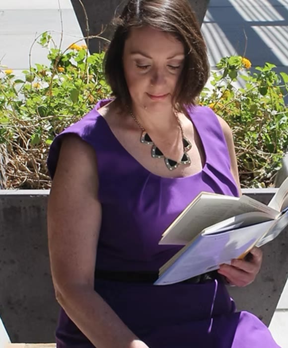 Karen Hurley reading outdoors